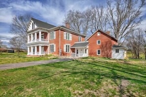 Your rental is the guest house - the smaller brick building and addition to its right.