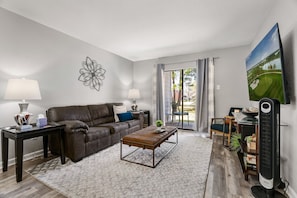 Comfy and cozy living space with golf course views.