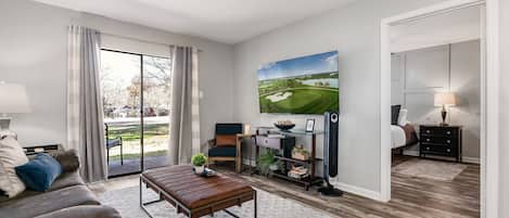 Enjoy the golf course view or your fav shows on the 65" smart tv.