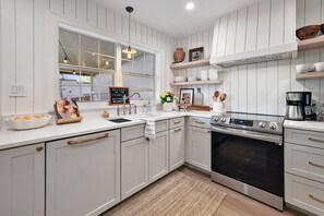 Completely Remodeled Kitchen with Stainless Appliances and Quartz Countertops