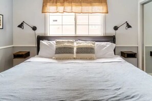 Master bedroom-king bed, air mattress, pack N play, space heater, bathroom 