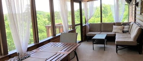 Screened back porch overlooking the beautiful Ozark scenery