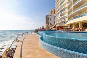 Large pool on the edge of beach