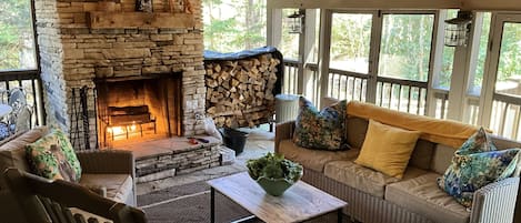 Screened back porch with wood burning fireplace