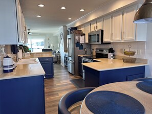 Well stocked Kitchen with bar area and everything you could possibly need to prepare fantastic meals at home!