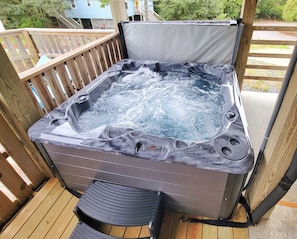 We JUST added a brand new hot tub so you can extend your summer in fall!