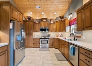 The Kitchen is open, airy & fully equipped. A grill out back can add to the menu