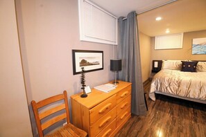 Main bedroom with Queen Bed, closet and Charging station