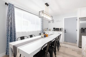 Dining table with 8 seats. Complementary coffee and tea on the counter.