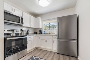 Fully equipped kitchen with stainless steel appliances