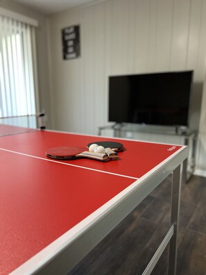 Game Room with Ping Pong Table and 50 inch Roku Smart TV