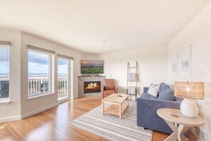 Cozy up next to the electric fireplace and watch one of your favorite streaming services on the Roku TV