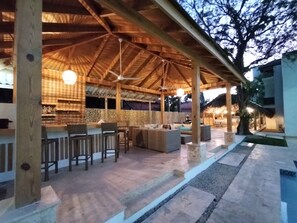 The bar, comfy seating area, BBQ & dining area.