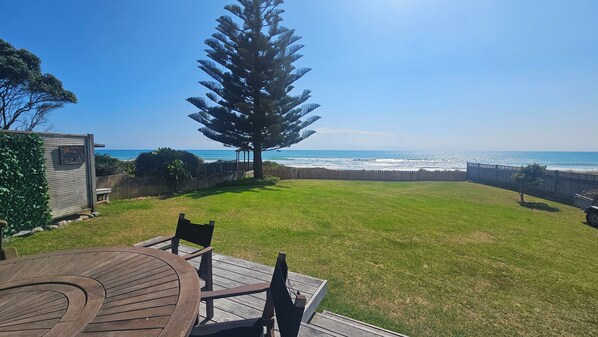 Large fenced beachfront lawn
