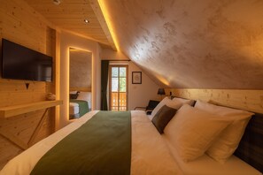 Alpine SPA Chalet - romantic bedroom with stunning views of Bohinj's nature.