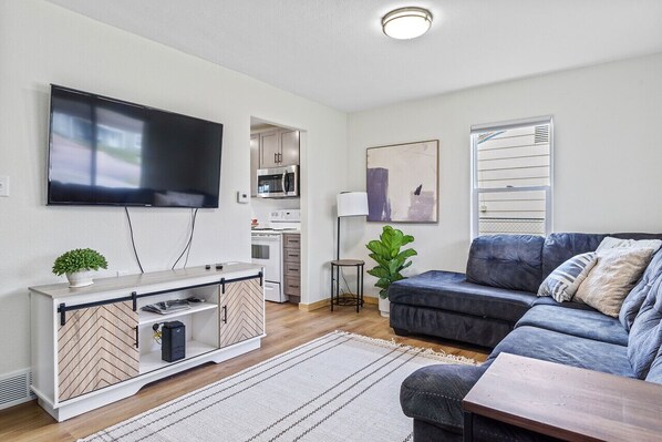 Relax and unwind in this inviting living room, where plush furnishings and chic designs create the perfect setting for gatherings and cozy evenings in.