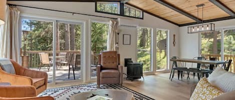 Open living area with floor-to-ceiling windows that allow you to relax in the beauty of nature