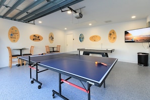 Air conditioned game room with ping pong, air hockey and 65" smart TV
