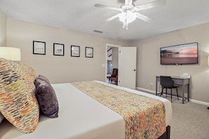 The Boardwalk Room is the primary bedroom with a king bed, 55" smart TV, desk