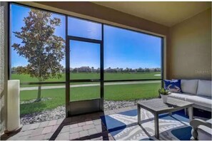 Screened in patio access door to golf course