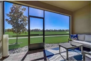 Screened in patio access door to golf course