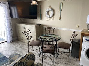 Murphy bed is under tv in cabinet in living room