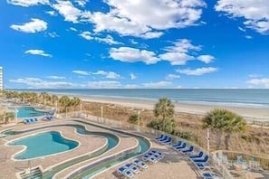 Resort Pool Deck w/ Stunning View of Beach