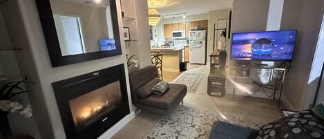 Modern and updated living room with fire place and Smart Samsung TV.