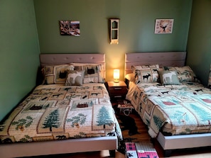 The Wildlife bedroom has 2 full-sized beds and a 45" tv