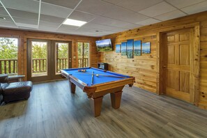 Pool table is in the downstairs game room. 