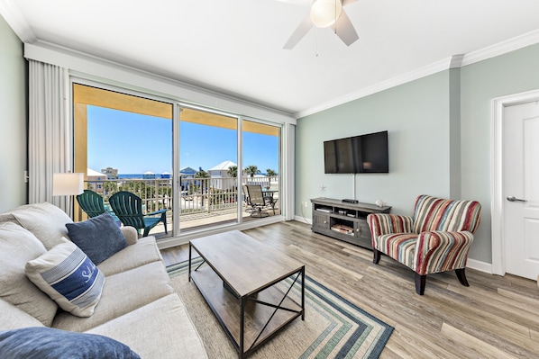 Living room. Step out to balcony overlooking pool and ocean.