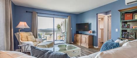 The SaltWater Flat is an end unit and overlooks the beautiful marsh,  Hunting Island and the Atlantic Ocean are seen in the distance. There is a smart TV in the main space.