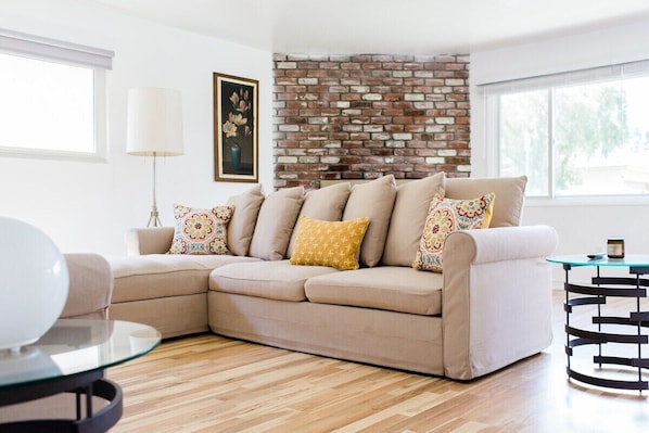 Living room sofa doubles up as a sofa bed for additional guests