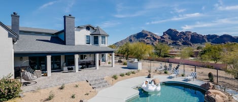 Stunning views of Camelback. Entertainer's yard - Rock pool with slide, bbq, putting green, fire place, fire pit and multiple lounge areas.