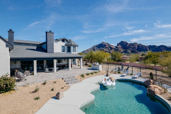 Stunning views of Camelback. Entertainer's yard - Rock pool with slide, bbq, putting green, fire place, fire pit and multiple lounge areas.