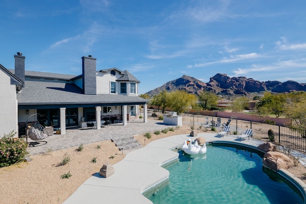 Stunning views of Camelback. Entertainer's yard - Rock pool with slide, bbq, putting green, fire place, fire pit and multiple lounge areas.
