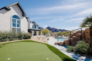 Stunning views of Camelback. Entertainer's yard - Rock pool with slide, bbq, putting green, fire place, fire pit and multiple lounge areas.