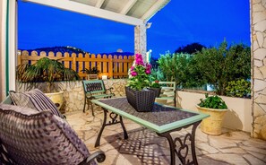 Οur terrace with a view of the illuminated castle