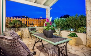 Οur terrace with a view of the illuminated castle