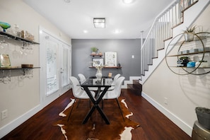 Cozy dining spot with a Spanish touch, featuring a four-seater table.