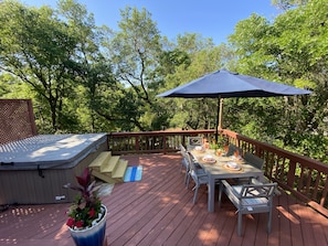 The 6 person hot tub sits on the deck, right outside the kitchen.  
