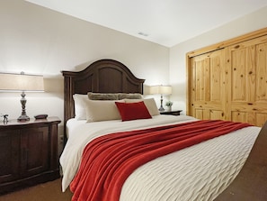 A second master bedroom features an en suite bathroom and 42" smart TV, located on the main level adjacent to the condo entrance/mudroom