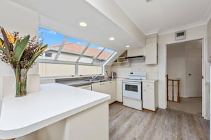 Open plan kitchen on upper level.