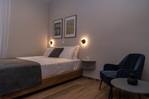 Queen-sized bed with seating area