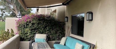 Outdoor living room with the glass, tabletop fire pit - overhang extended