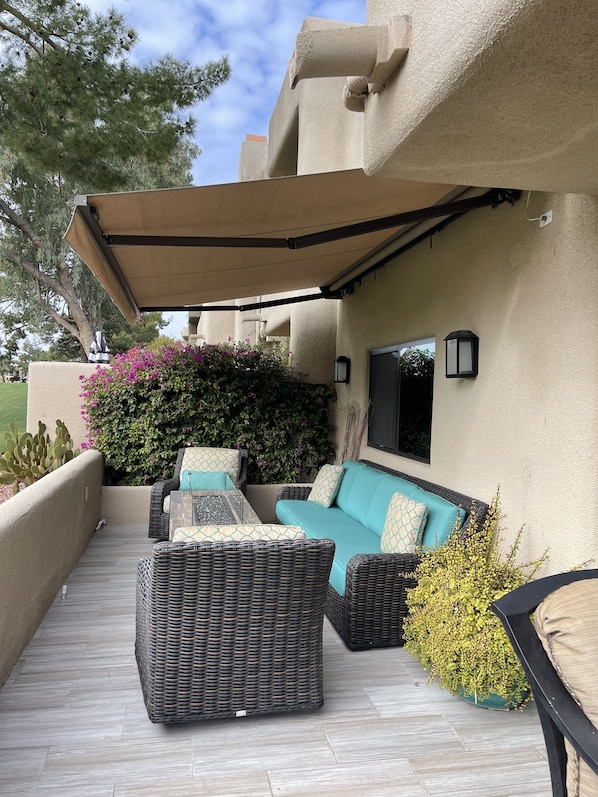 Outdoor living room with the glass, tabletop fire pit - overhang extended