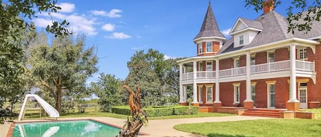 Refreshing pool and cabana off the mansion with wrap around patio and deck