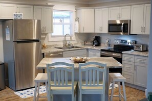 Totally renovated kitchen with island bar and seating for 4
