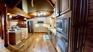 Large kitchen, granite counter tops, Induction stove, microwave, coffee maker