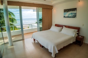 Master bedroom facing the sandy beach and surf